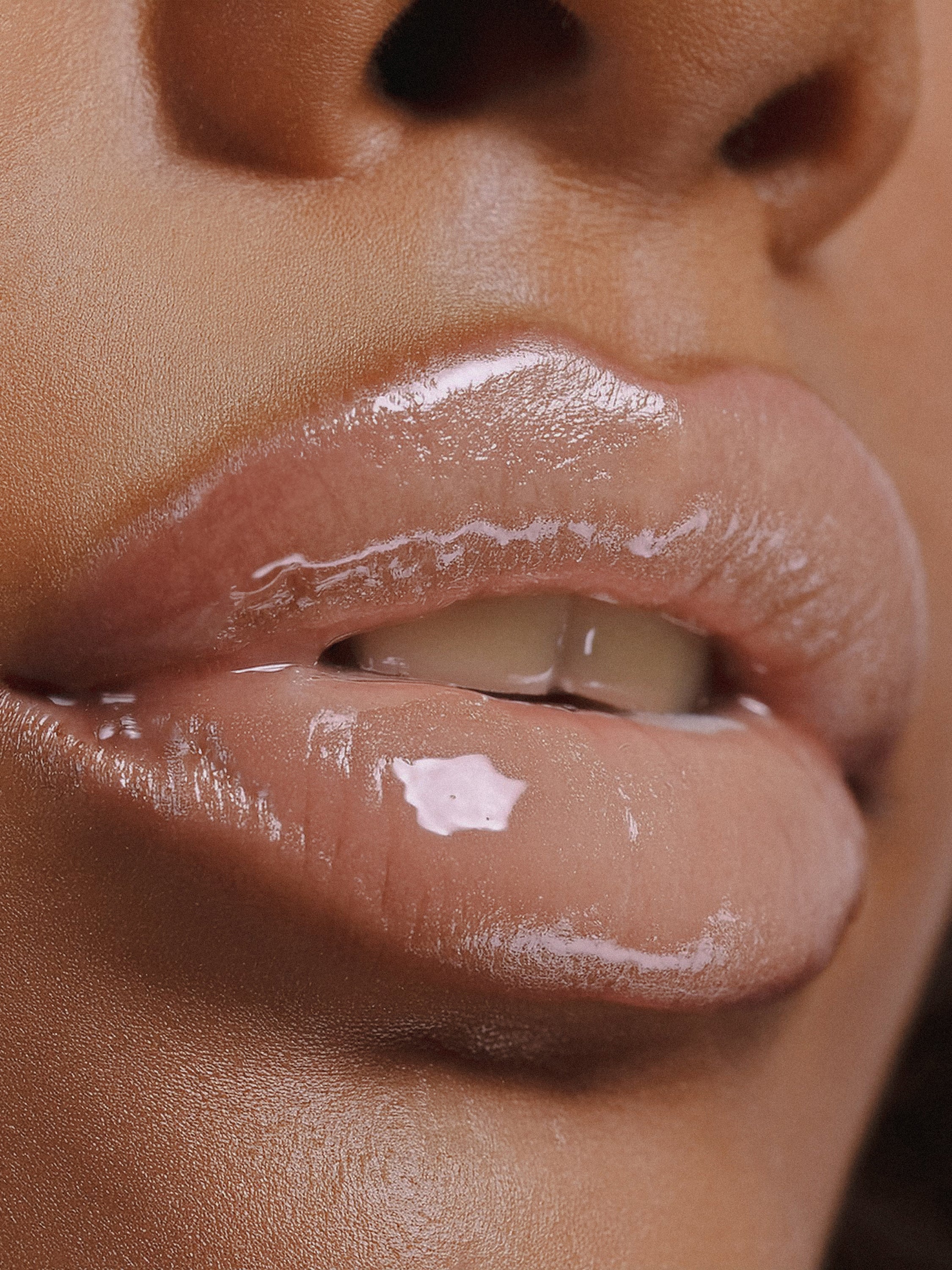 Model wearing Skinacy Hydrating Lip Glaze for plump, hydrated lips